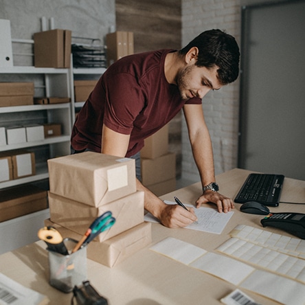a person using a laptop computer sitting on top of a table